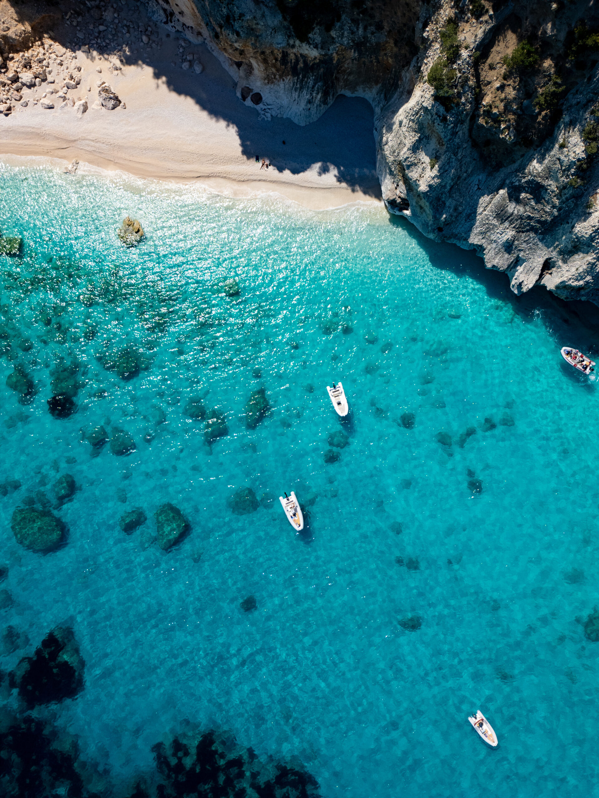 Home a drone view of cala goloritzé, an azure beach located in the town of baunei, in the southern part of the gulf of orosei, in the ogliastra region of sardinia.